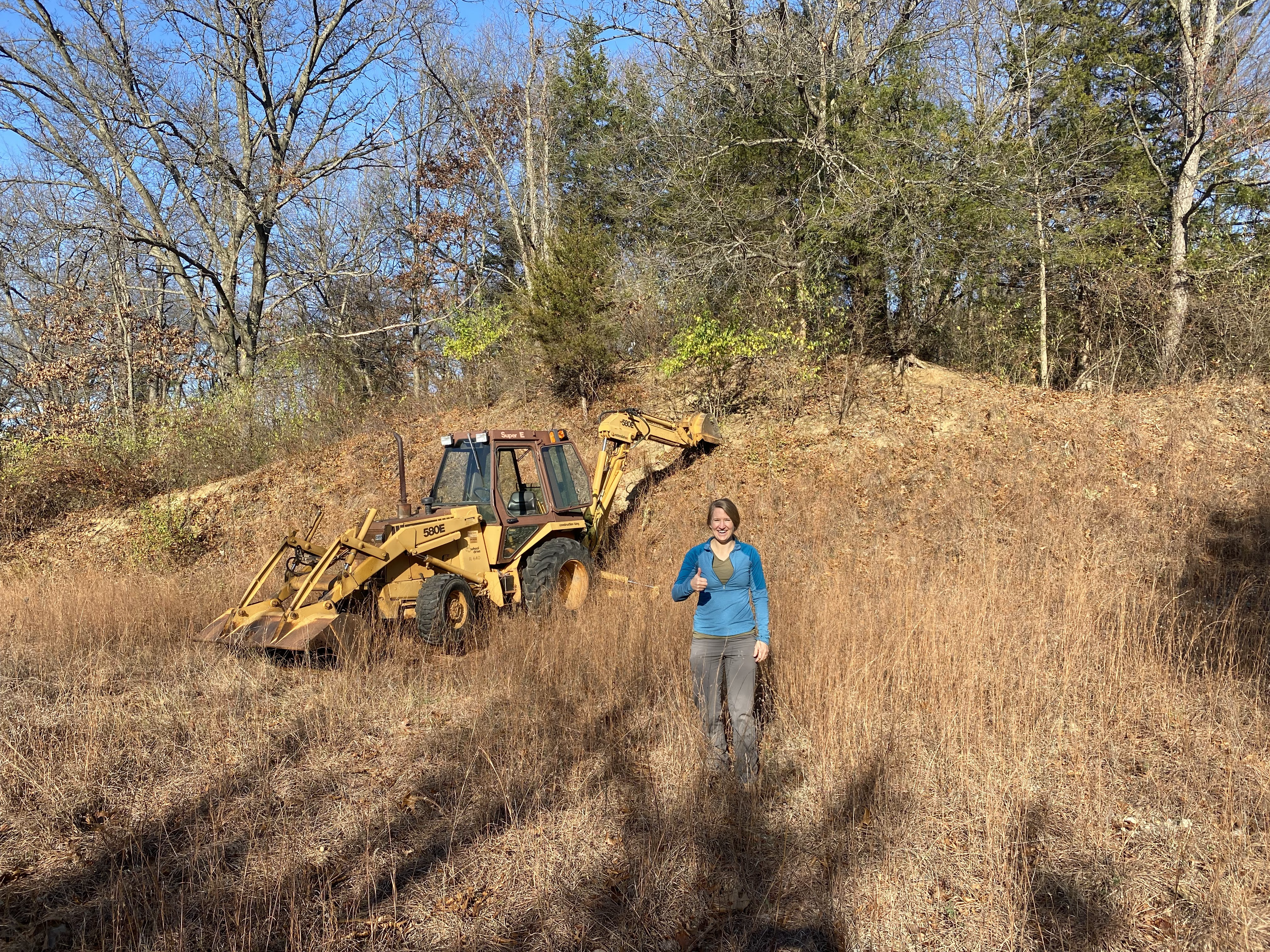 An excavator is ready to help us get rid of pesky vegetation